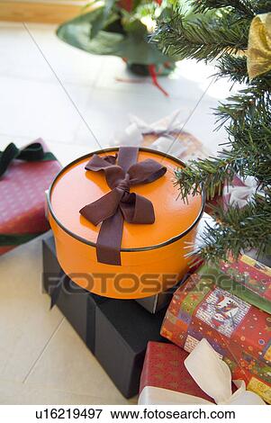 Stock Photo - Christmas presents under tree. Fotosearch