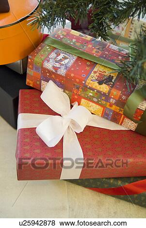 Christmas presents under tree View Large Photo Image Stock Photo - Christmas presents under tree. Fotosearch