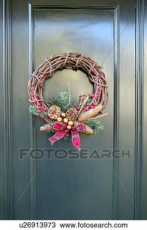 Stock Image - Christmas wreath on door. Fotosearch