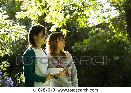 Two young women looking ahead View Large Photo Image Stock Image - Two young women looking ahead. Fotosearch