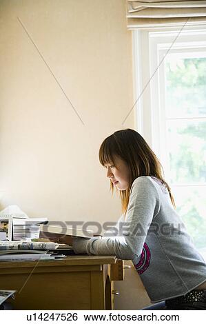 Young woman studying View Large Photo Image Stock Photograph - Young woman studying. Fotosearch