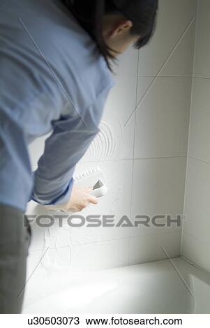 A woman cleaning bathroom View Large Photo Image Stock Image - A woman cleaning bathroom. Fotosearch