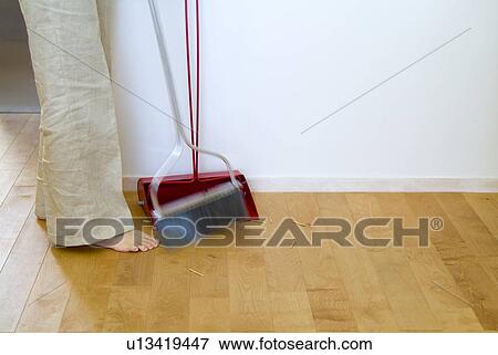 A woman cleaning floor View Large Photo Image Stock Photo - A woman cleaning floor. Fotosearch
