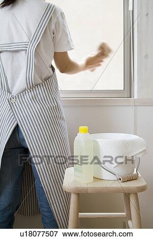 A woman cleaning window, blurred motion View Large Photo Image Stock Photo - A woman cleaning window, blurred motion. Fotosearch