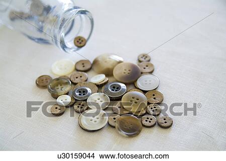 Picture - Buttons and glass jar. Fotosearch