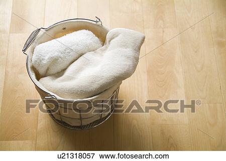 Towels in laundry basket View Large Photo Image Stock Photo - Towels in laundry basket. Fotosearch
