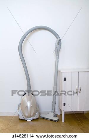 Vacuum cleaner and dresser View Large Photo Image Picture - Vacuum cleaner and dresser. Fotosearch