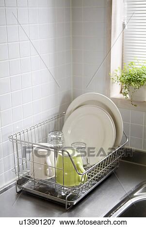 Washed dishes in dish rack View Large Photo Image Stock Photo - Washed dishes in dish rack. Fotosearch