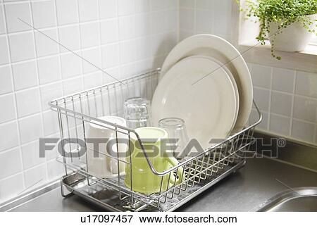 Washed dishes in dish rack View Large Photo Image Stock Photo - Washed dishes in dish rack. Fotosearch