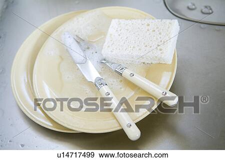 Washed dishes in kitchen sink View Large Photo Image Stock Photo - Washed dishes in kitchen sink. Fotosearch