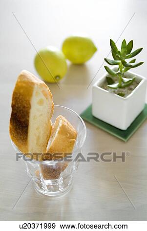 Stock Photo - Baguette slices in glass. Fotosearch