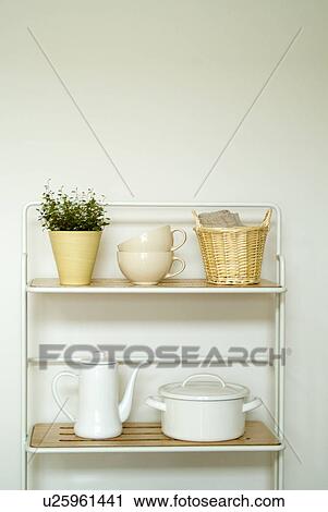 Kitchen utensils in shelf View Large Photo Image Stock Image - Kitchen utensils in shelf. Fotosearch