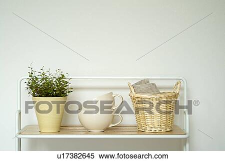 Stock Photography - Kitchen utensils in shelf. Fotosearch