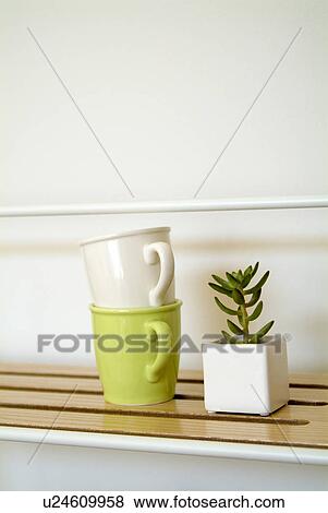 Stock Photo - Potted plant and mugs. Fotosearch