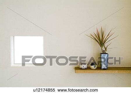 Stock Photography - Potted plant on shelf. Fotosearch