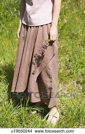 A woman wearing organic dyed clothes View Large Photo Image Picture - A woman wearing organic dyed clothes. Fotosearch