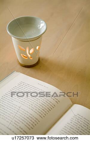 Aromatherapy burner and book View Large Photo Image Stock Image - Aromatherapy burner and book. Fotosearch
