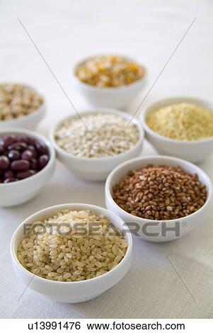 Stock Photograph - Assorted rice and beans in bowls. Fotosearch