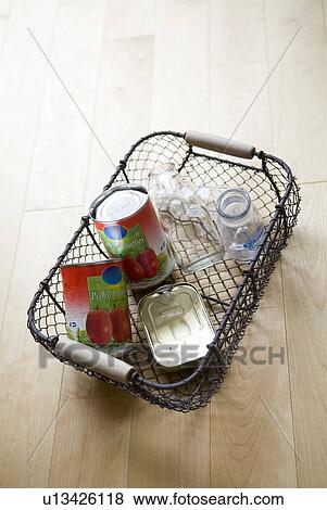 Empty bottles and cans in a basket View Large Photo Image Stock Photo - Empty bottles and cans in a basket. Fotosearch