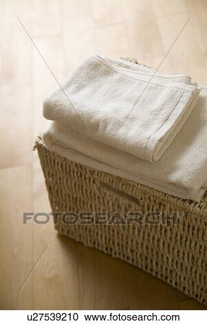 Folded towels on a basket View Large Photo Image Stock Image - Folded towels on a basket. Fotosearch