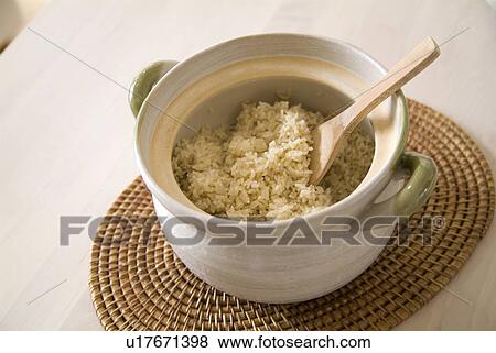 Stock Photo - Steamed brown rice in pot. Fotosearch