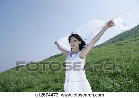 A young woman outstretching arms View Large Photo Image Stock Image - A young woman outstretching arms. Fotosearch