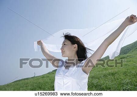 A young woman outstretching arms View Large Photo Image Stock Image - A young woman outstretching arms. Fotosearch