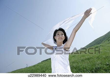 A young woman outstretching arms View Large Photo Image Stock Image - A young woman outstretching arms. Fotosearch