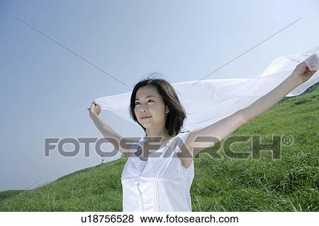 A young woman outstretching arms View Large Photo Image Stock Photo - A young woman outstretching arms. Fotosearch