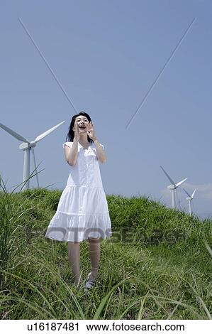 A young woman shouting in field View Large Photo Image Stock Image - A young woman shouting in field. Fotosearch