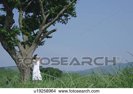 A young woman shouting View Large Photo Image Picture - A young woman shouting. Fotosearch