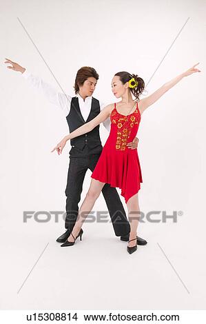 Picture - Young couple dancing salsa. Fotosearch