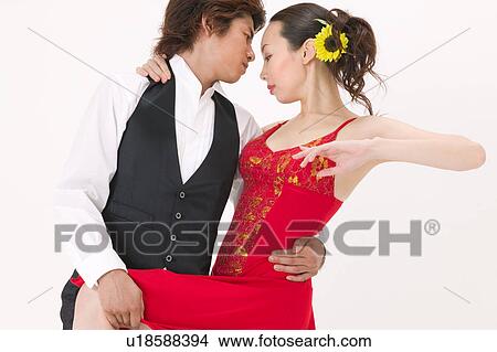 Picture - Young couple dancing salsa. Fotosearch