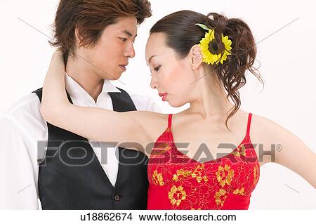 Picture - Young couple dancing salsa. Fotosearch