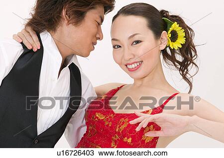 Stock Image - Young couple dancing salsa. Fotosearch