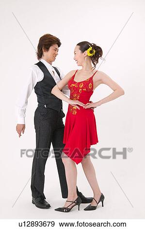 Stock Photo - Young couple dancing salsa. Fotosearch