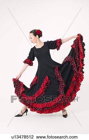 Young woman dancing the flamenco View Large Photo Image Stock Image - Young woman dancing the flamenco. Fotosearch