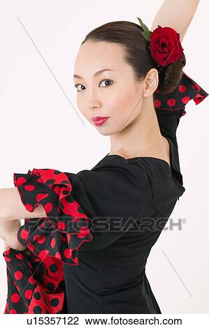 Young woman dancing the flamenco View Large Photo Image Stock Image - Young woman dancing the flamenco. Fotosearch