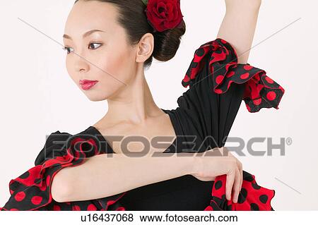 Young woman dancing the flamenco View Large Photo Image Stock Photo - Young woman dancing the flamenco. Fotosearch