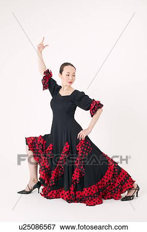 Young woman dancing the flamenco View Large Photo Image Stock Photo - Young woman dancing the flamenco. Fotosearch