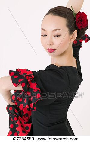 Young woman dancing the flamenco View Large Photo Image Stock Photo - Young woman dancing the flamenco. Fotosearch