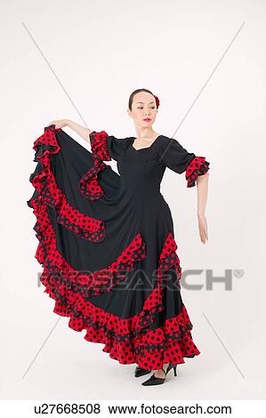 Young woman dancing the flamenco View Large Photo Image Stock Photo - Young woman dancing the flamenco. Fotosearch