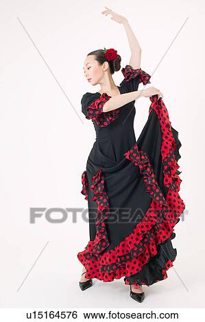 Young woman dancing the flamenco View Large Photo Image Stock Photograph - Young woman dancing the flamenco. Fotosearch