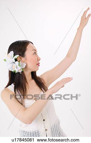 Young woman dancing the hula View Large Photo Image Stock Image - Young woman dancing the hula. Fotosearch