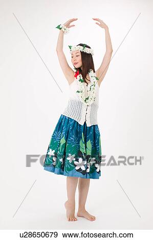 Young woman dancing the hula View Large Photo Image Stock Photo - Young woman dancing the hula. Fotosearch