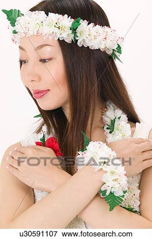 Young woman dancing the hula View Large Photo Image Stock Photo - Young woman dancing the hula. Fotosearch