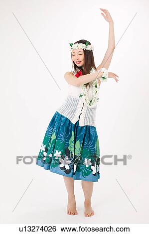Stock Photograph - Young woman dancing the hula. Fotosearch