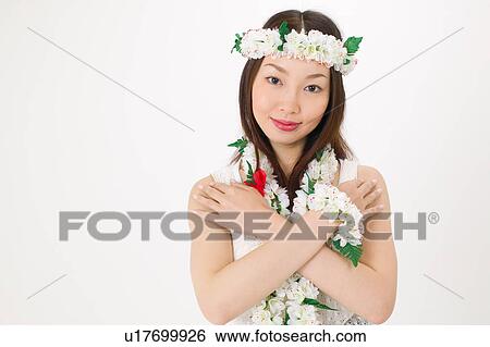 Young woman dancing the hula View Large Photo Image Stock Photograph - Young woman dancing the hula. Fotosearch