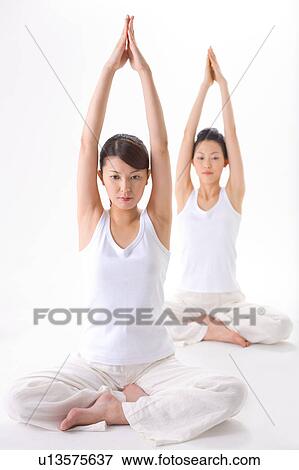 Young women doing Yoga View Large Photo Image Stock Photo - Young women doing Yoga. Fotosearch