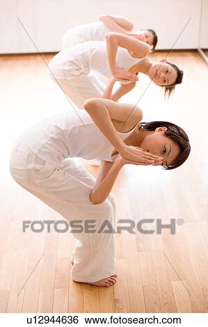 Young women doing Yoga View Large Photo Image Stock Photograph - Young women doing Yoga. Fotosearch